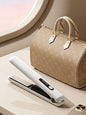 White adjustable temperature hair straightener by Trendsi with sleek design and heat control for smooth, styled hair.