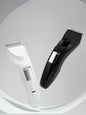 White cordless rechargeable hair clipper by Trendsi with a sleek design, suitable for professional and home grooming.