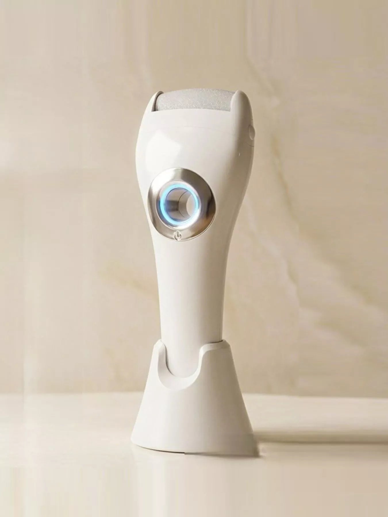 White electric foot nail buffer with LED light from Trendsi, showcasing a compact device for smooth, polished nails.