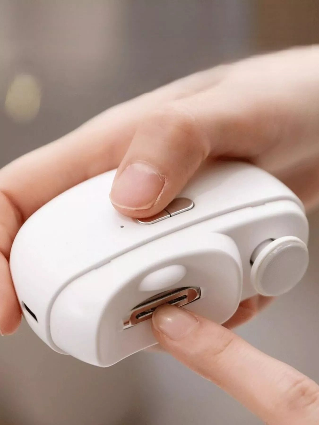 White electric nail buffer by Trendsi with multiple polishing surfaces for smooth, shiny nails.