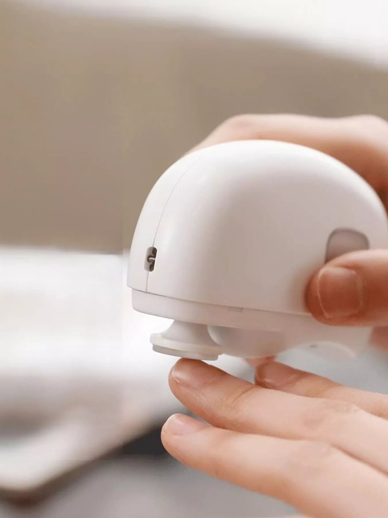 White electric nail buffer from Trendsi with a sleek design, used for smoothing and polishing nails.