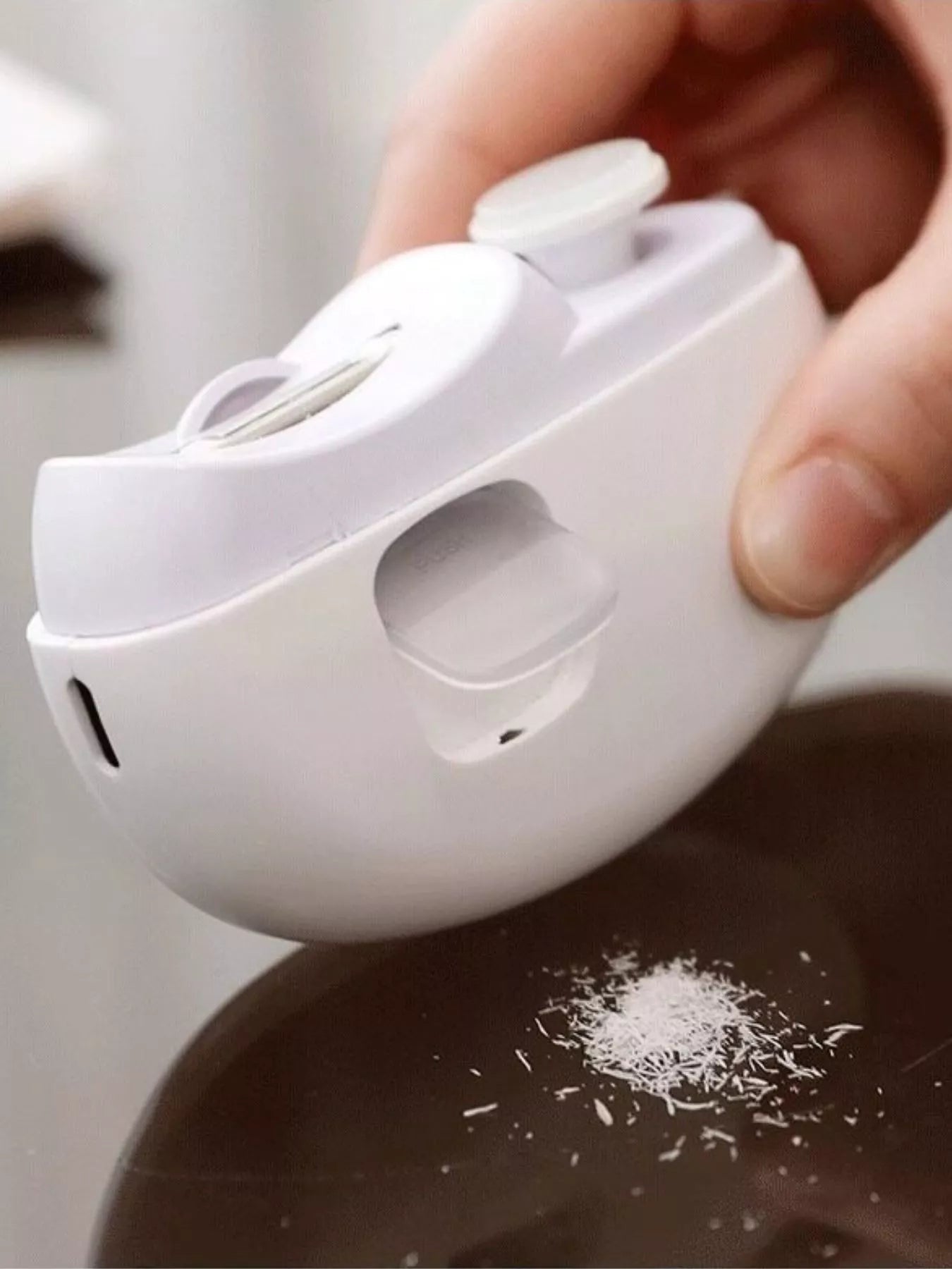 White electric nail buffer from Trendsi with multiple polishing surfaces for smooth, shiny nails.