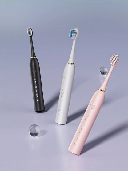 White electric toothbrush with multiple brushing modes, sleek design, and ergonomic handle from Trendsi.