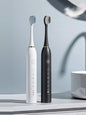 White electric toothbrush with multiple brushing modes, Trendsi brand, featuring a sleek design and interchangeable brush head.