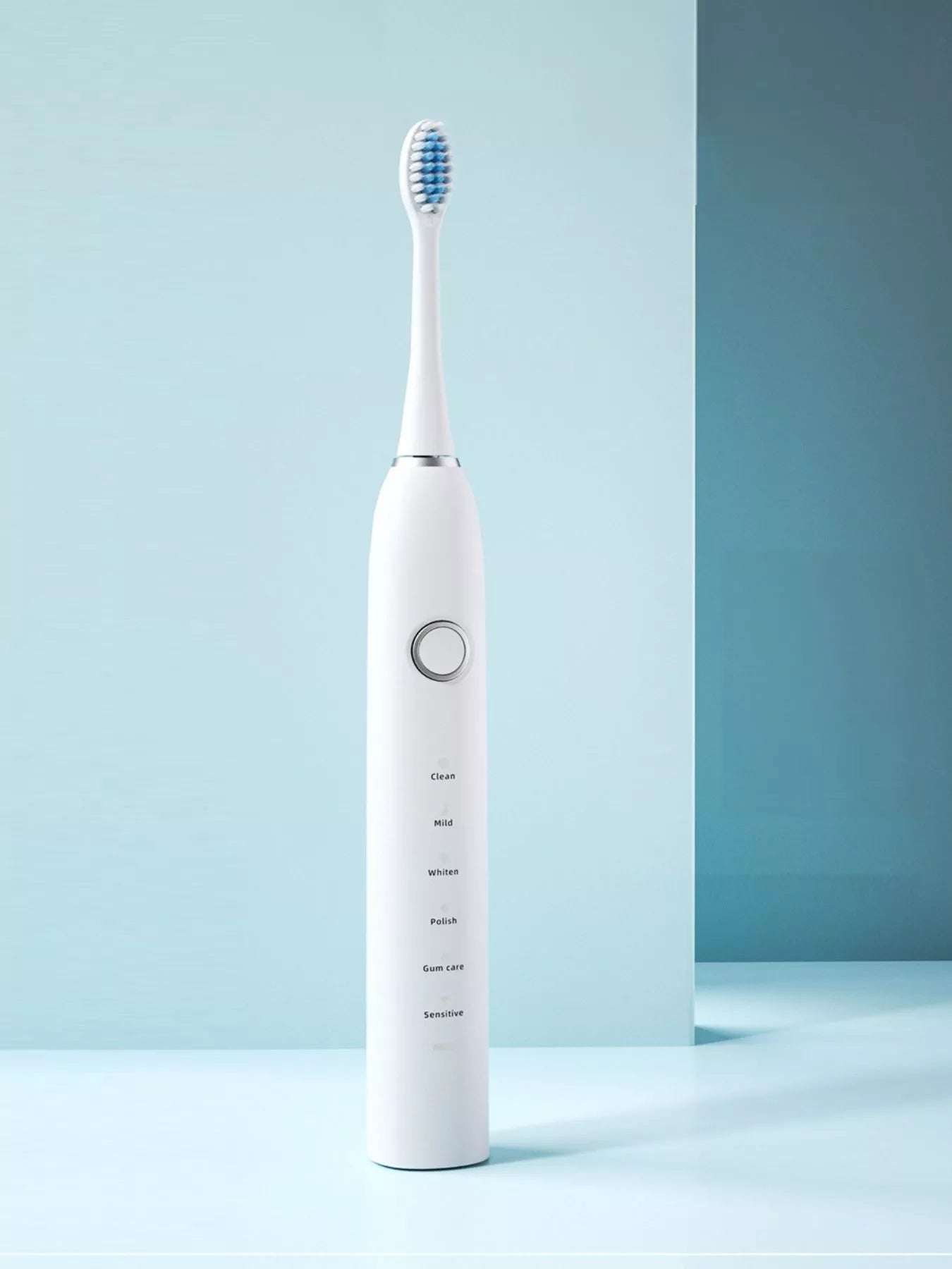 White electric toothbrush with multiple brushing modes, sleek design, and ergonomic handle from Trendsi.