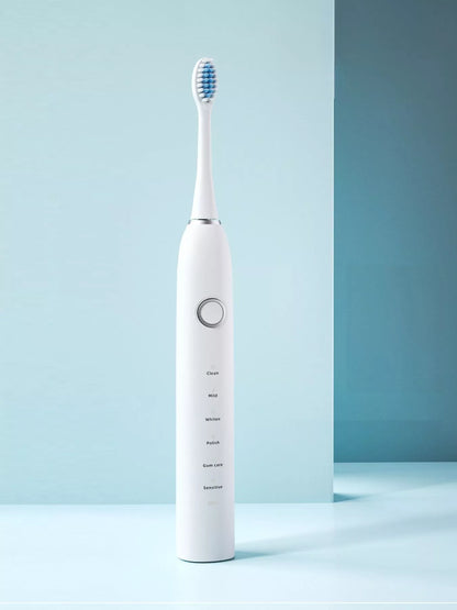 White electric toothbrush with multiple brushing modes, sleek design, and ergonomic handle from Trendsi.