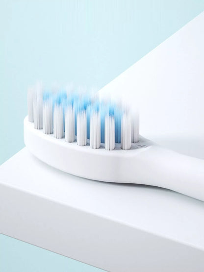 White electric toothbrush with multiple cleaning modes, branded Trendsi, featuring a sleek design and ergonomic handle.
