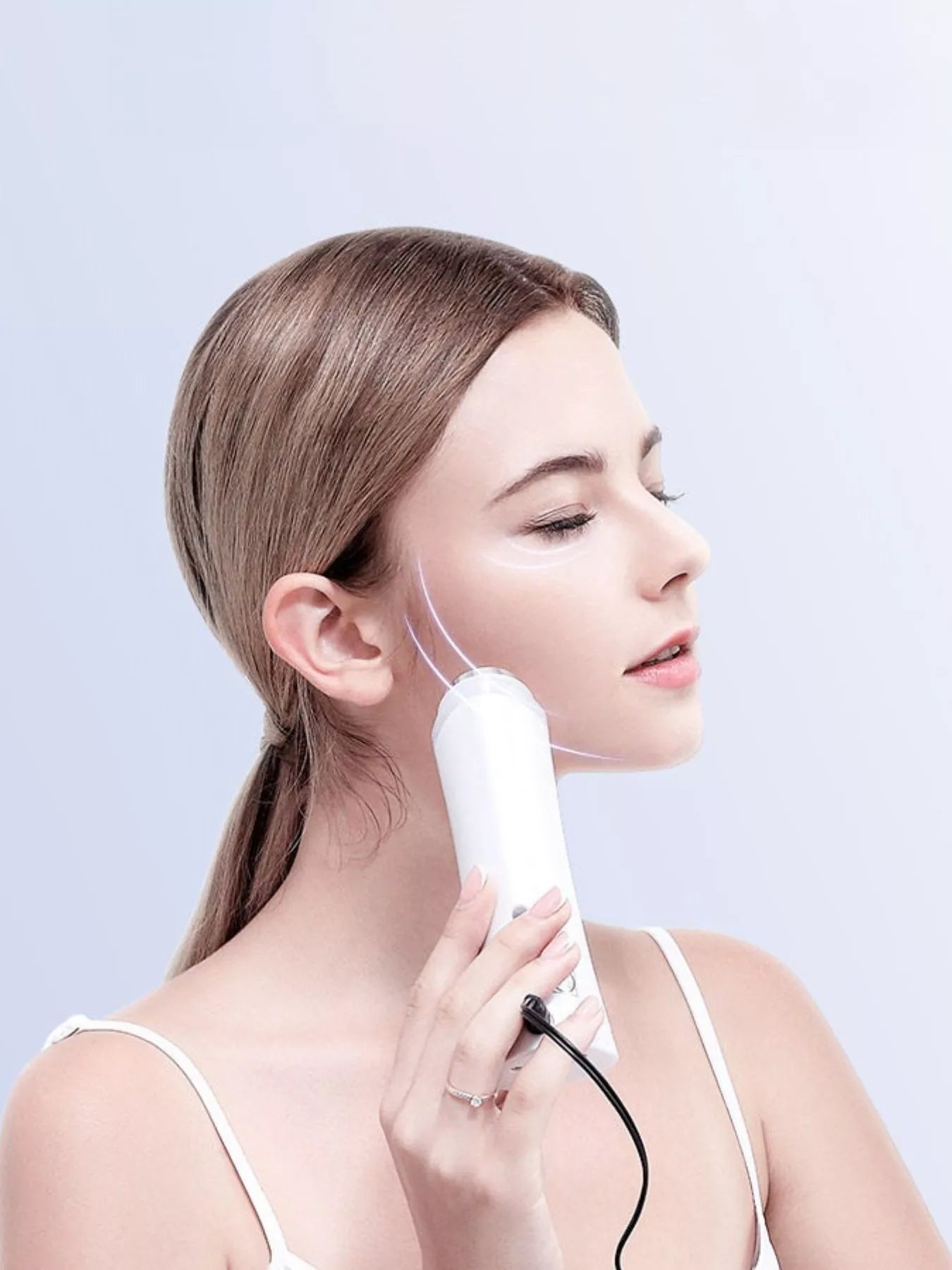 White facial skin tightening beauty device from Trendsi, shown with sleek design and controls for skincare treatment.