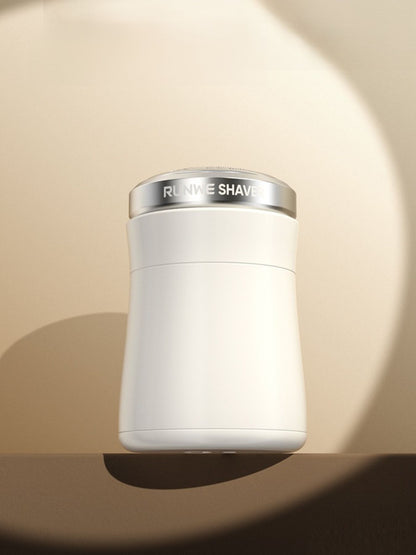 White painless electric hair remover by Trendsi with a sleek handheld design and compact size for easy hair removal.
