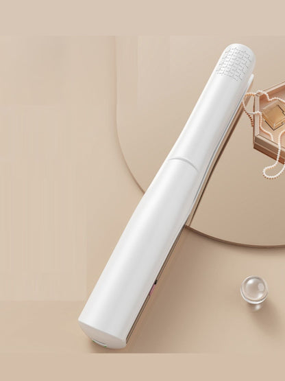 White portable ceramic hair straightener by Trendsi, compact design with ceramic plates for smooth, straight hair.
