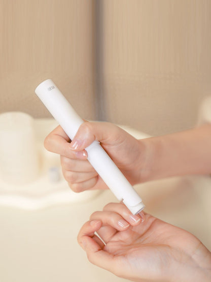 White portable electric nail buffer by Trendsi, compact design with multiple polishing surfaces for smooth, professional-looking nails.