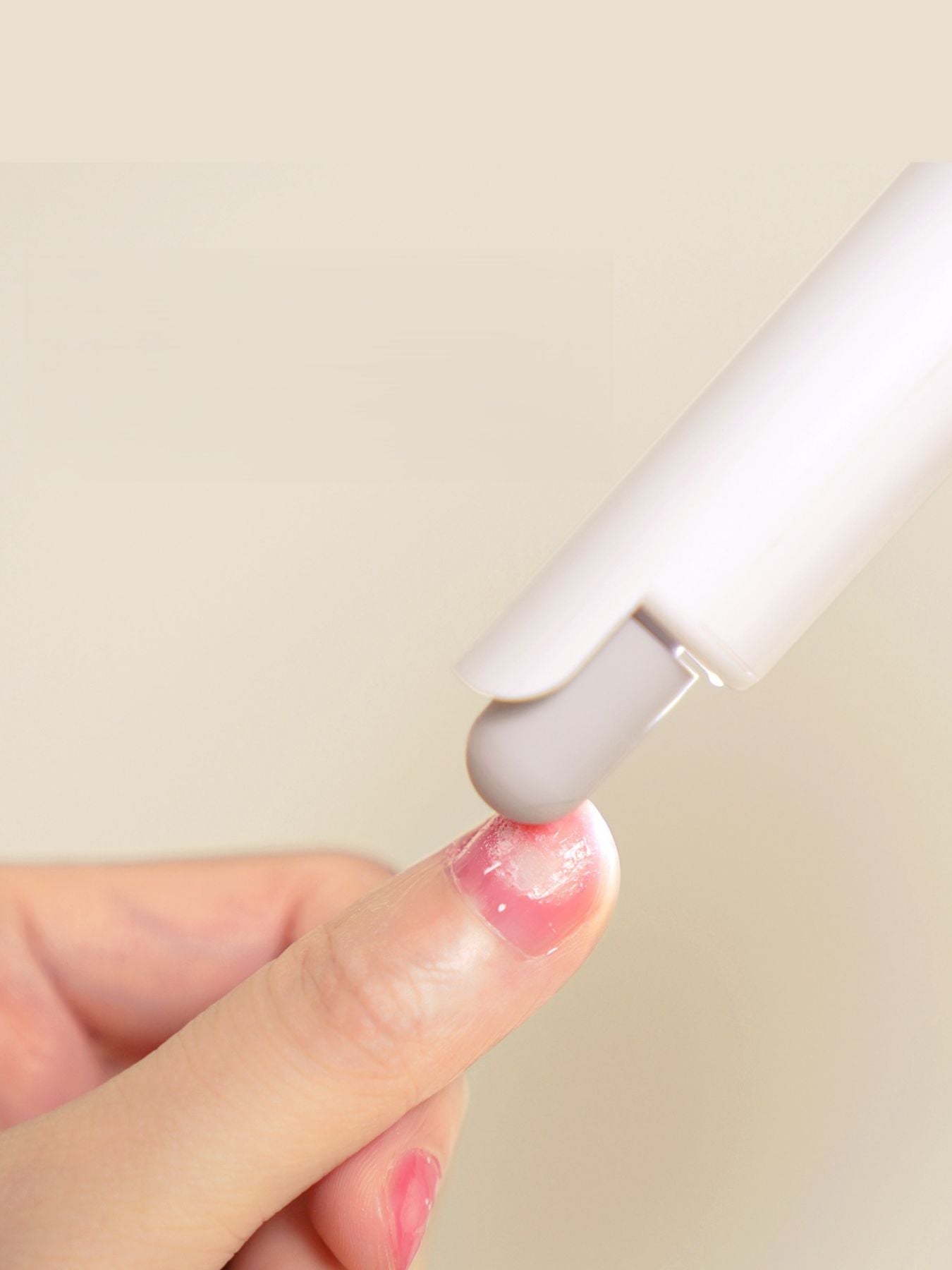 White portable electric nail buffer by Trendsi with multiple polishing surfaces for smooth, professional nail finishing.