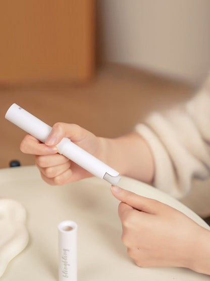 White portable electric nail buffer by Trendsi, compact design with multiple polishing surfaces for filing and buffing nails.
