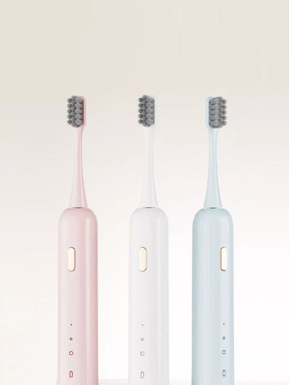 White portable electric toothbrush by Trendsi with a compact design and rechargeable handle for travel use.