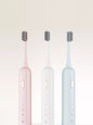 White portable electric toothbrush by Trendsi with a compact design and rechargeable handle for travel use.