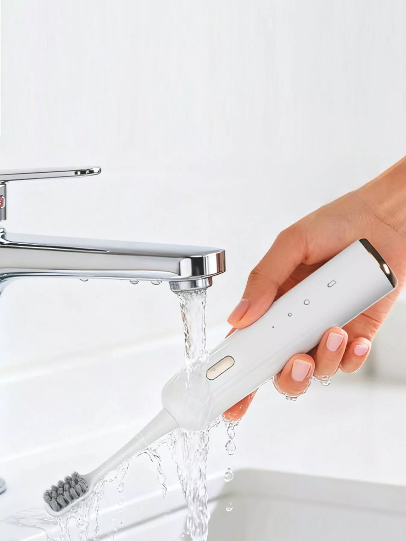 White portable electric toothbrush by Trendsi with a compact design and rechargeable battery for convenient oral care.