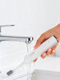 White portable electric toothbrush by Trendsi with a compact design and rechargeable battery for convenient oral care.