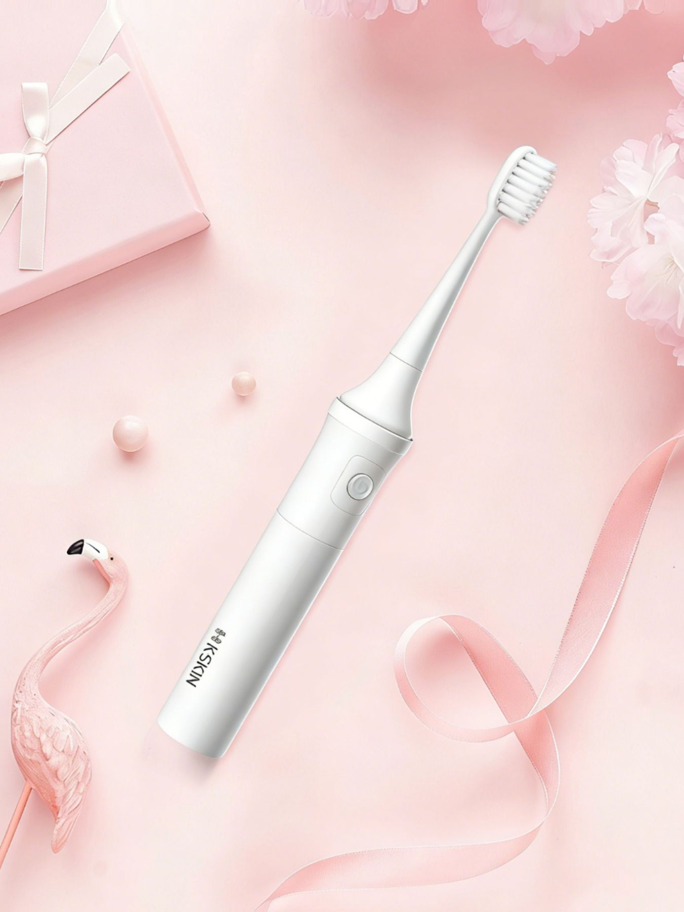 White portable electric toothbrush by Trendsi with a compact design and ergonomic handle for on-the-go oral care.
