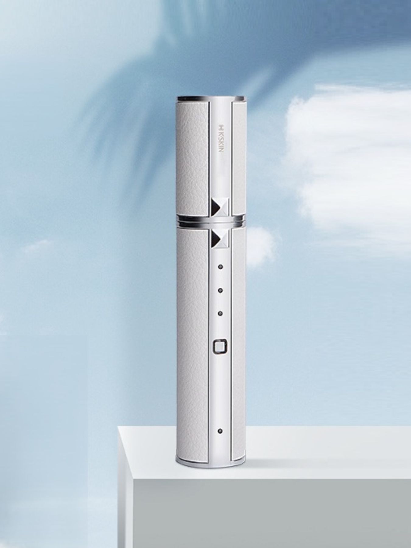 White portable facial beauty device by Trendsi with sleek design, perfect for skincare on the go.
