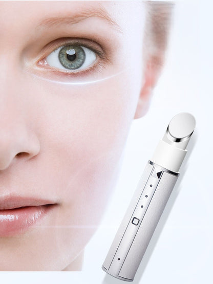 White portable facial beauty device by Trendsi, compact skincare gadget with sleek design for at-home facial treatments.