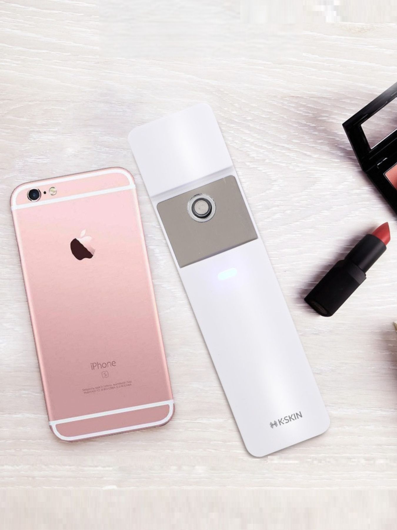 White portable facial mister beauty device by Trendsi, compact and handheld for refreshing skincare on the go.
