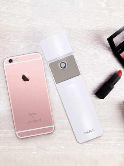 White portable facial mister beauty device by Trendsi, compact and handheld for refreshing skincare on the go.