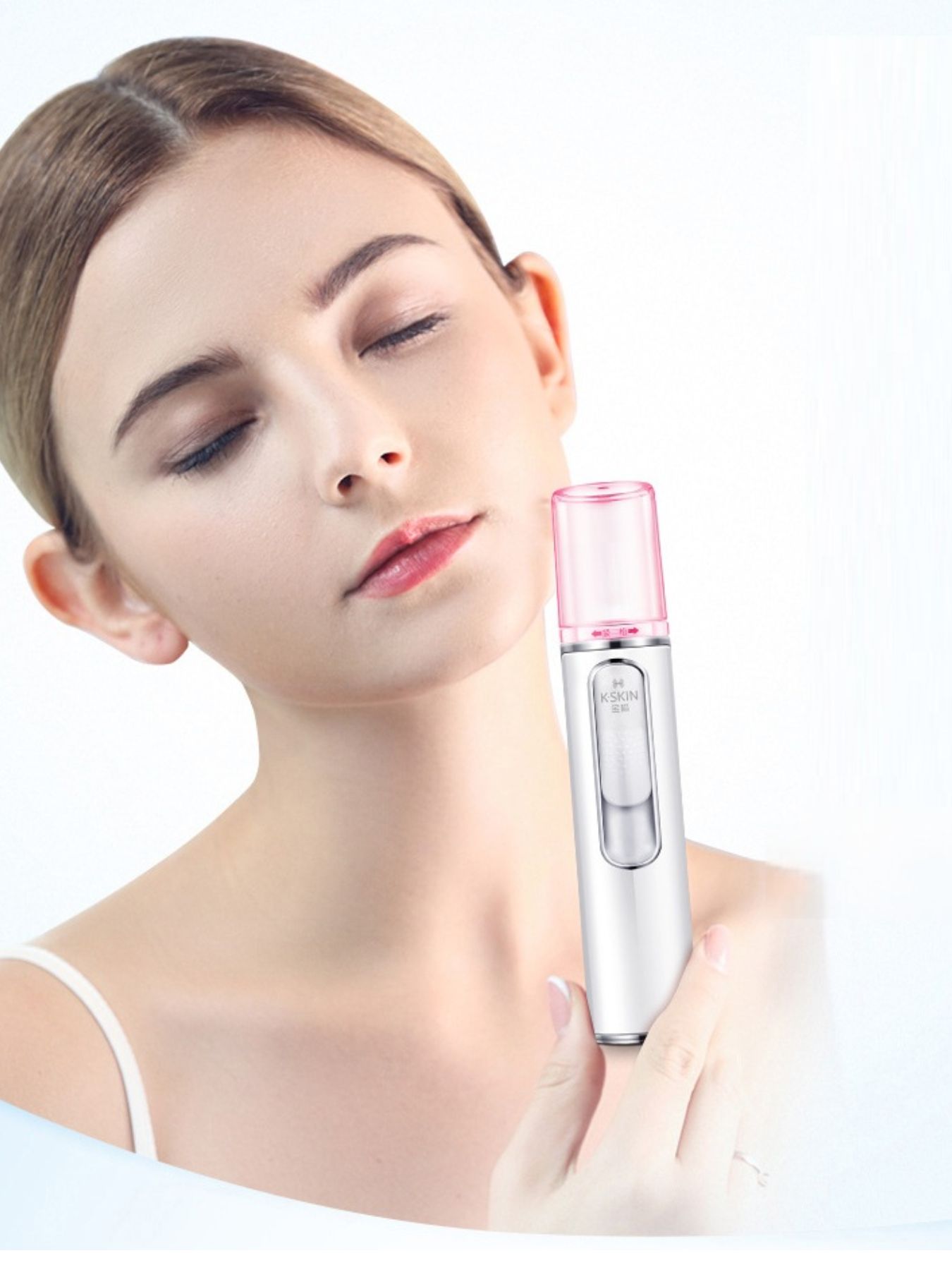 White portable facial mister nano sprayer from Trendsi, compact skincare device with fine mist spray for refreshing skin.