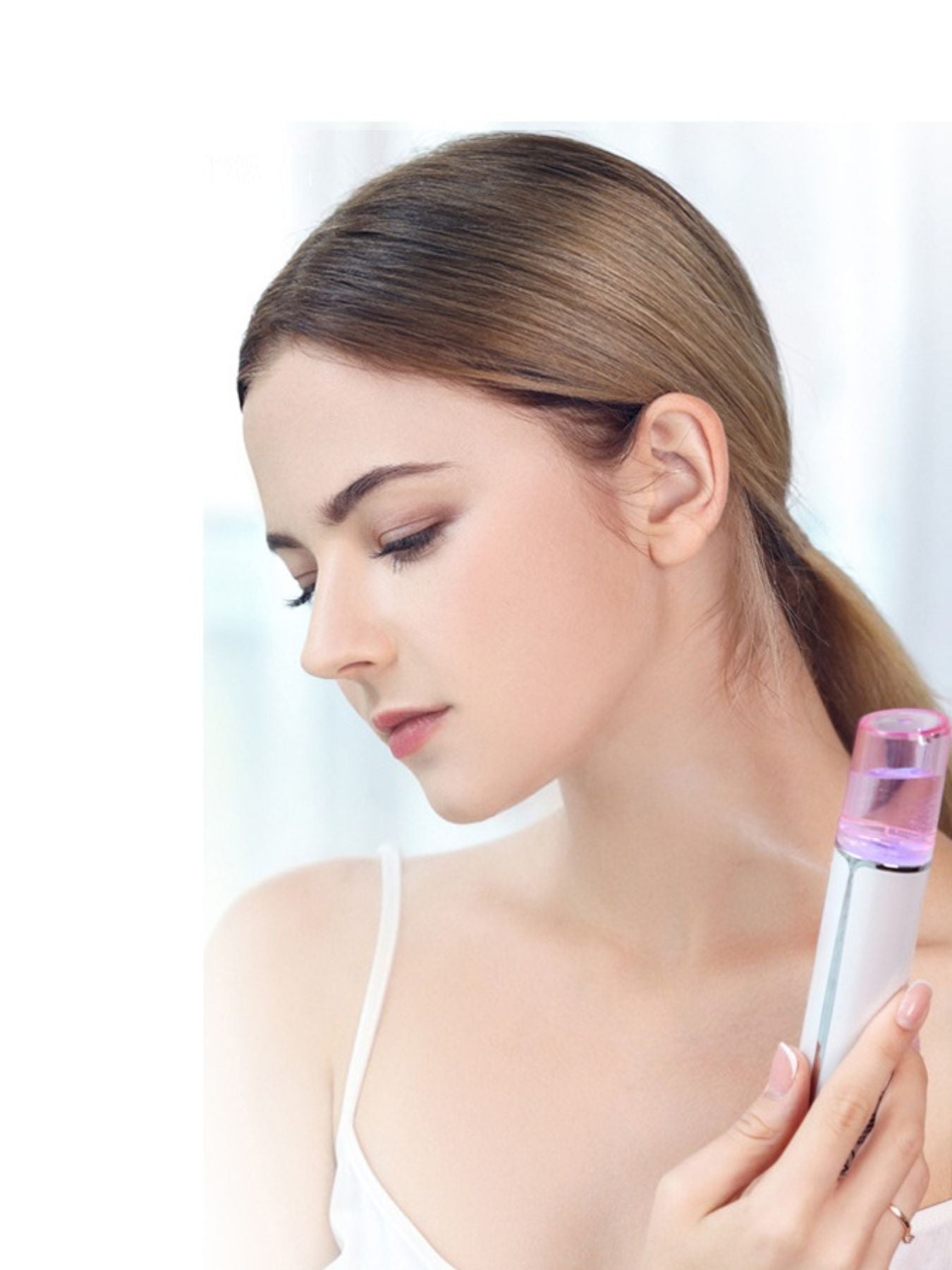 White portable facial mister nano sprayer by Trendsi, compact skincare device for refreshing and hydrating skin on the go.