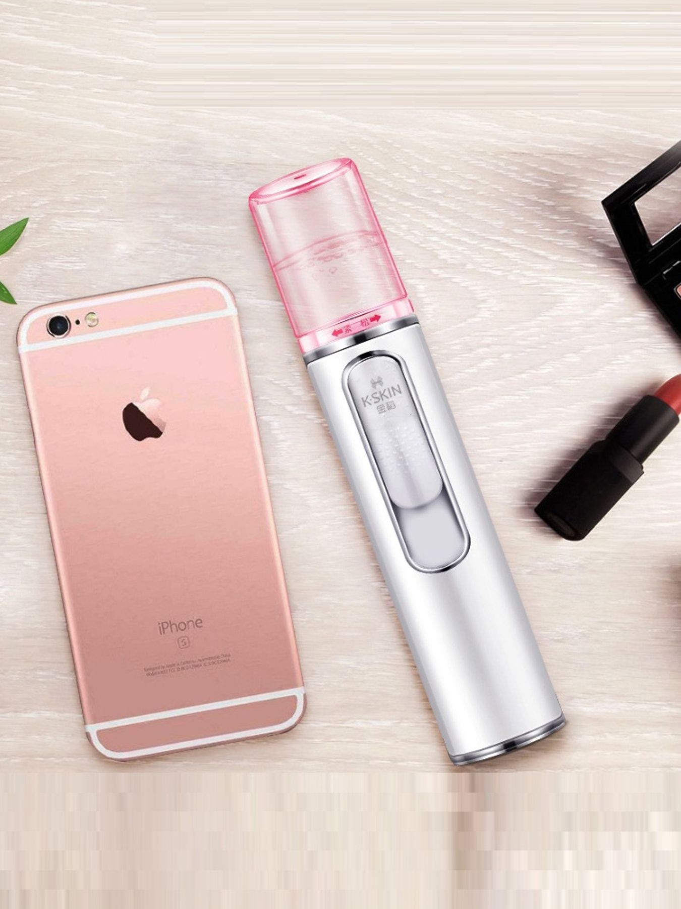 White portable facial nano sprayer by Trendsi, compact device for refreshing and hydrating skin with fine mist.