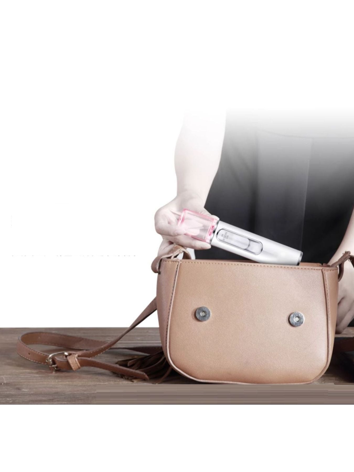 White portable facial mister nano sprayer by Trendsi, compact skin hydration device with a sleek design for easy use.