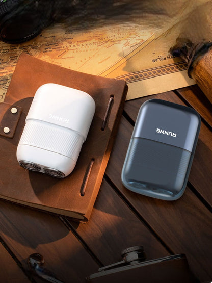 White portable mini electric shaver by Trendsi with compact design, ideal for travel and quick grooming.