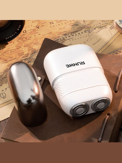 White portable mini electric shaver by Trendsi, compact design with stainless steel blades for quick grooming.