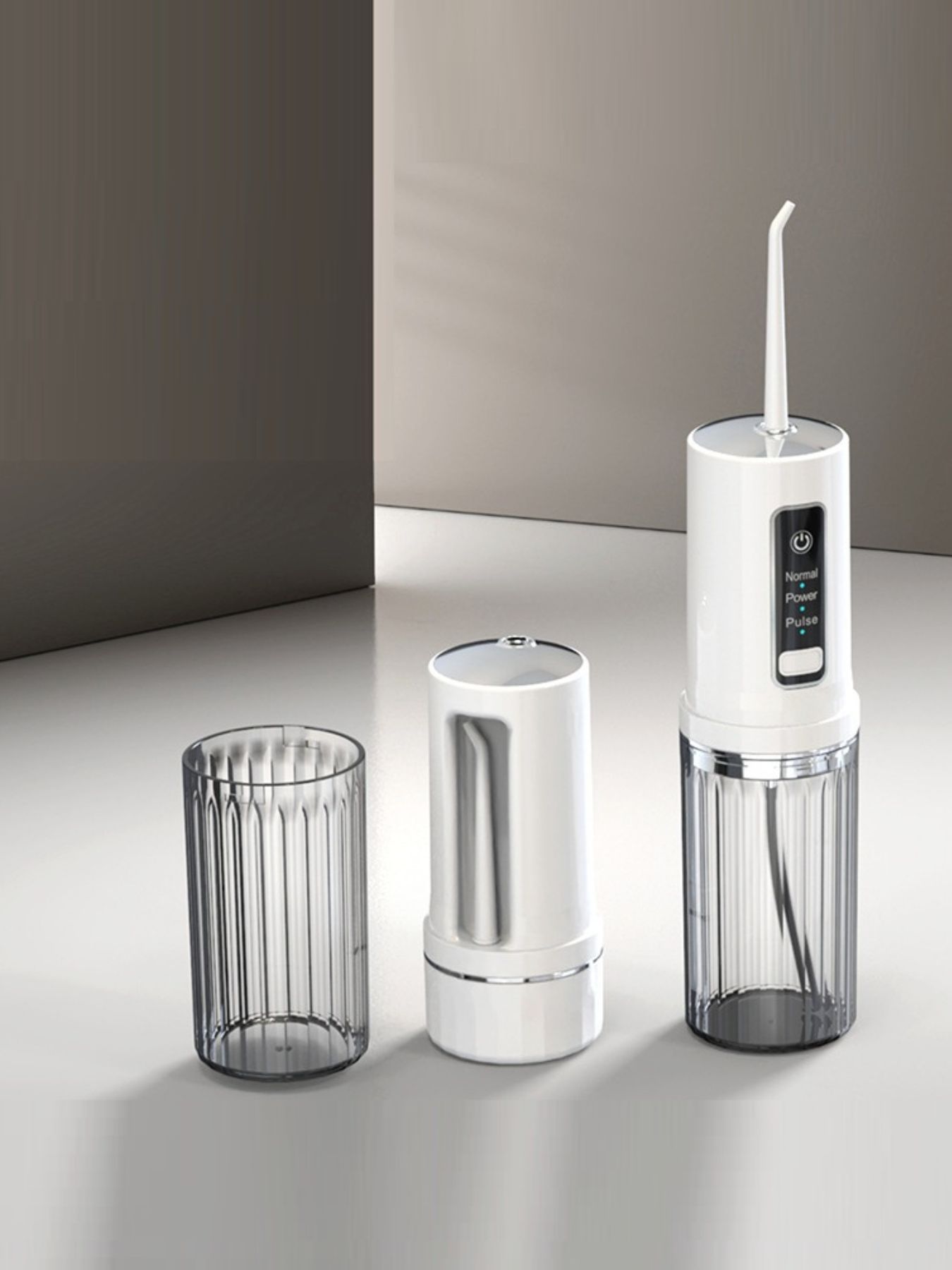 White portable rechargeable power dental flosser by Trendsi with ergonomic design and water reservoir for easy oral hygiene.