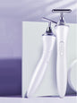 White T-shape Trendsi microcurrent facial massager device for skin toning and anti-aging skincare.