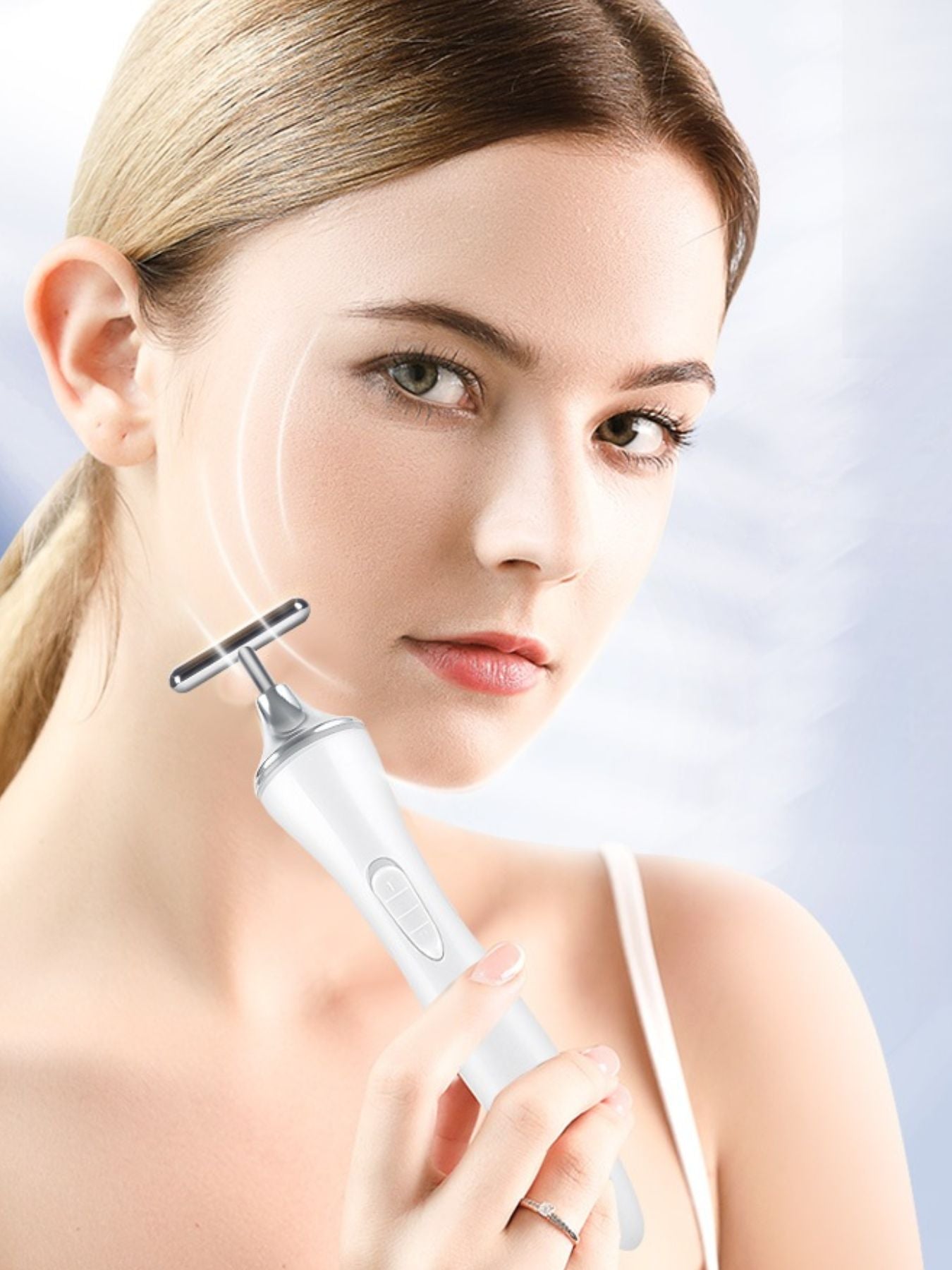 White T-shape microcurrent facial massager by Trendsi, a beauty device used for facial toning and skin rejuvenation.