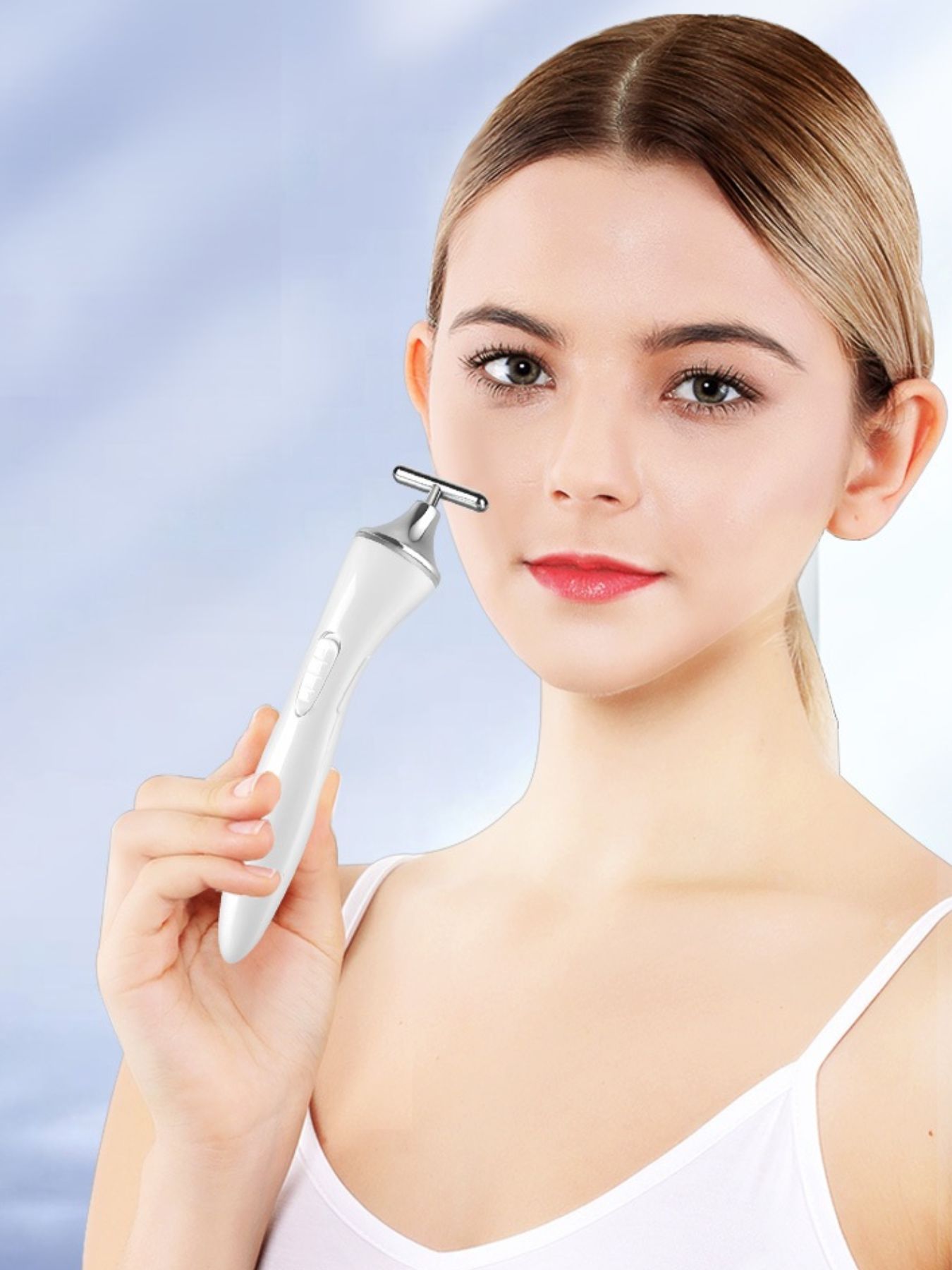 White T-shape microcurrent facial massager by Trendsi, a beauty device for facial toning and skin rejuvenation.