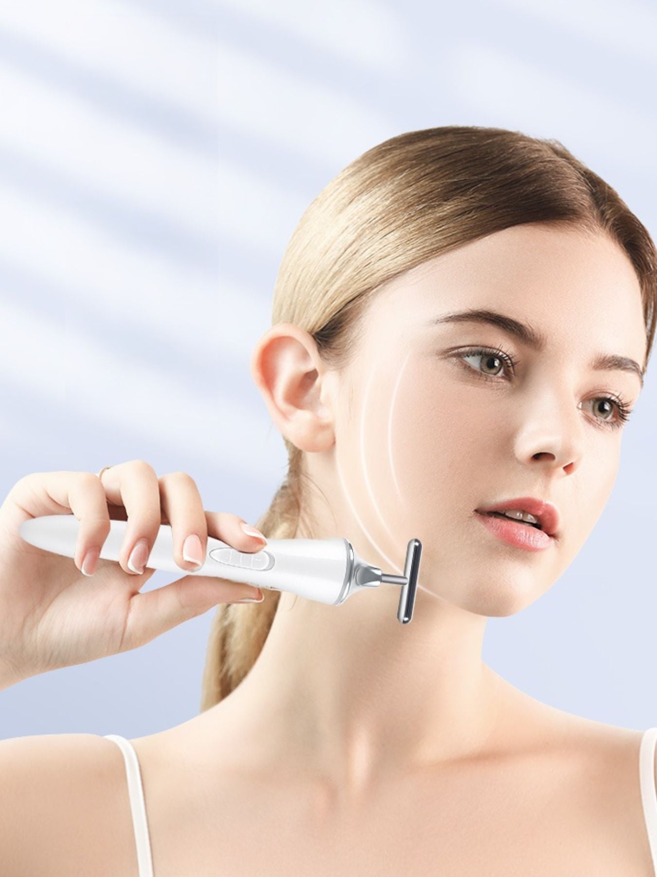 White T-shape microcurrent facial massager from Trendsi, a beauty device for facial toning and skin rejuvenation.