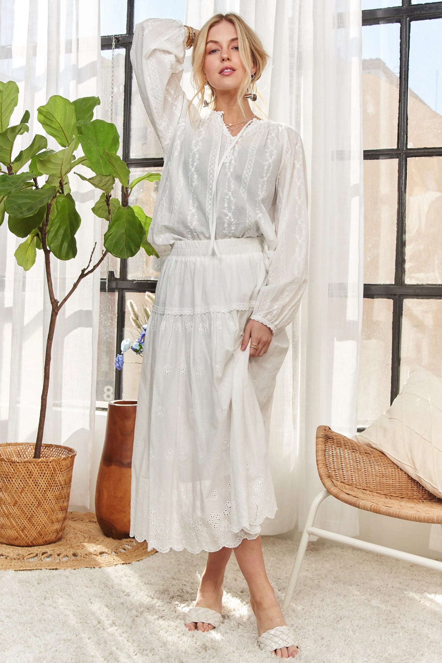 White ADORA cotton peasant top by Trendsi, featuring a relaxed fit with a gathered neckline and flowy sleeves.