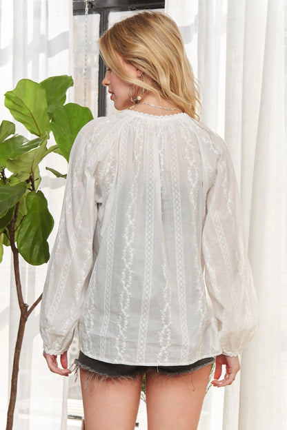 White ADORA Cotton Peasant Top by Trendsi featuring a relaxed fit, short sleeves, and a gathered neckline with embroidery details.