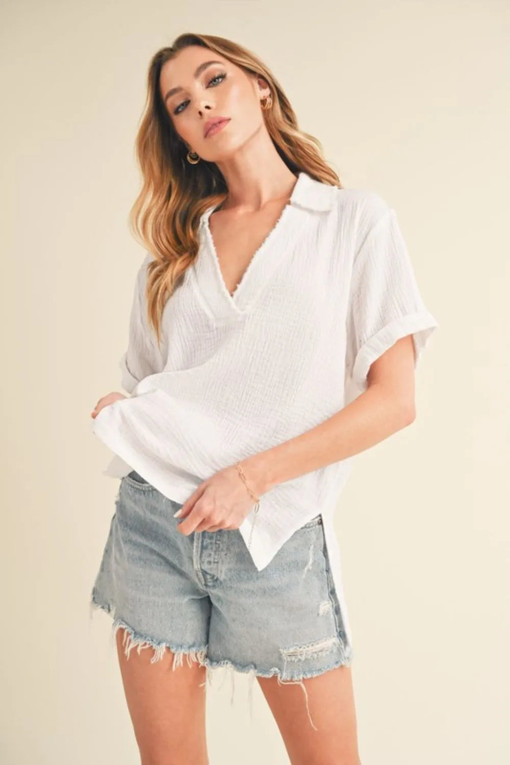White Aemi + Co cotton gauze blouse with side slit and Johnny collar, short sleeve, casual and breathable for warm weather.