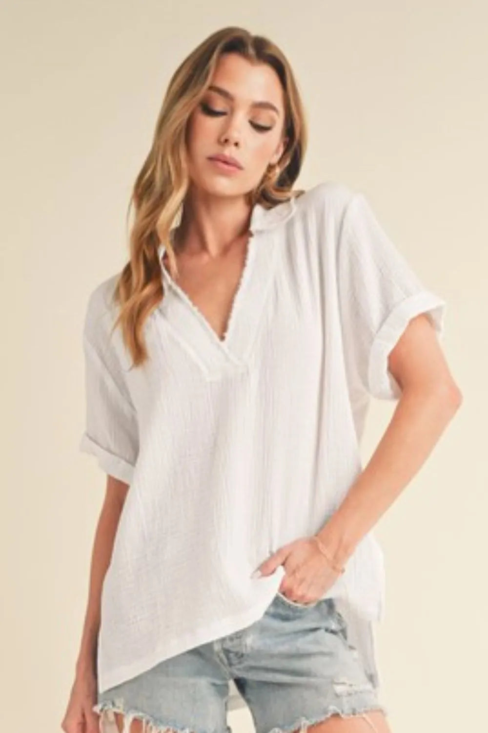 White Aemi + Co cotton gauze blouse with side slits and Johnny collar, short sleeves, casual and breathable for warm weather.