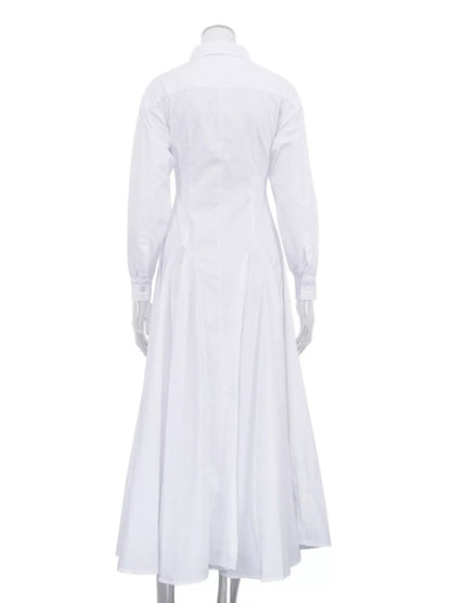 White button-front long sleeve maxi shirt dress by Trendsi, featuring a relaxed fit and classic collar for casual or dressy occasions.