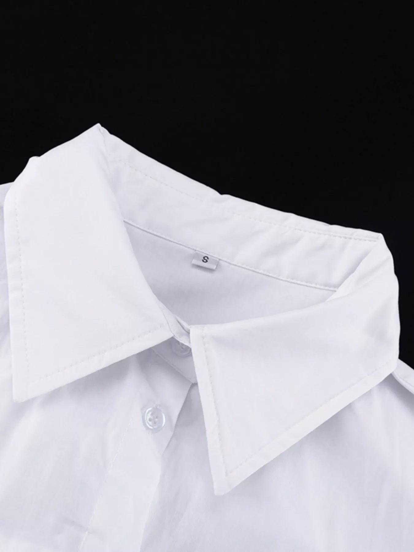 White button-front long sleeve maxi shirt dress by Trendsi, featuring a relaxed fit and classic collar.