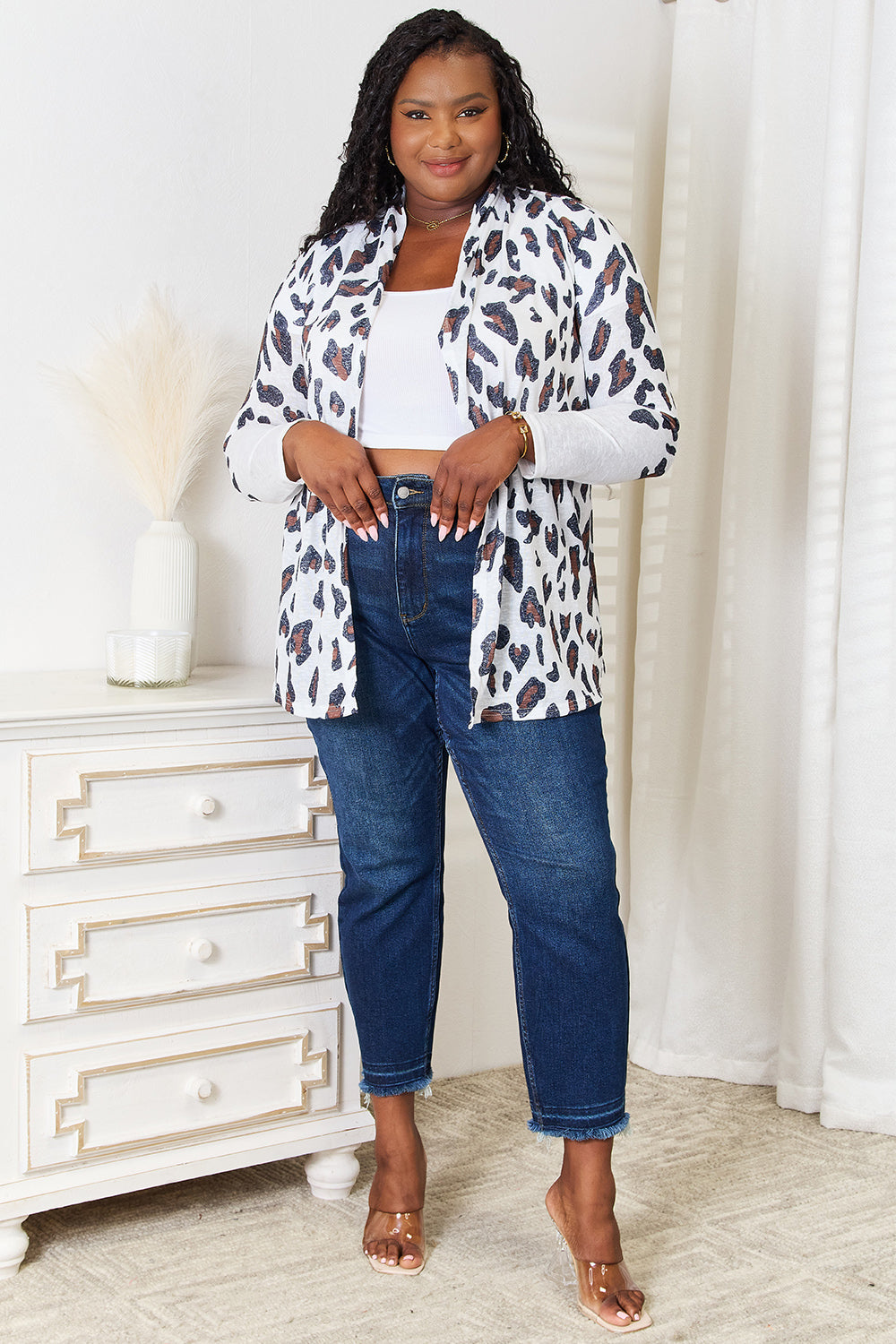 White leopard print long sleeve cardigan by Trendsi featuring a cozy, stylish design with a relaxed fit.