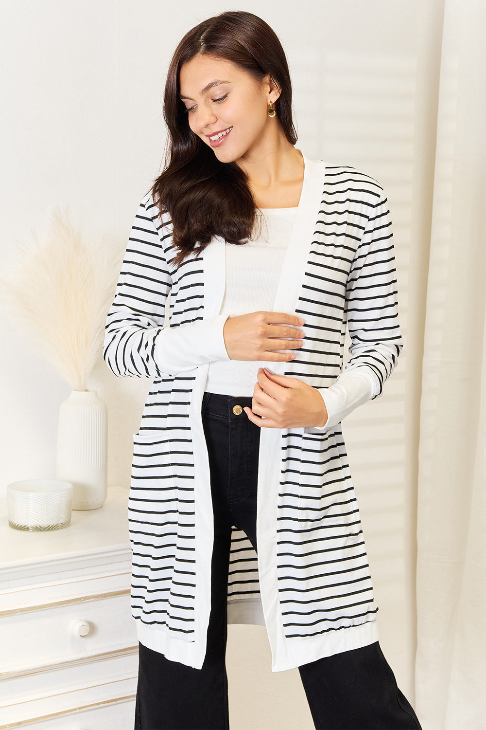 White double take striped open front longline cardigan from Trendsi, featuring a relaxed fit and cozy knit fabric.