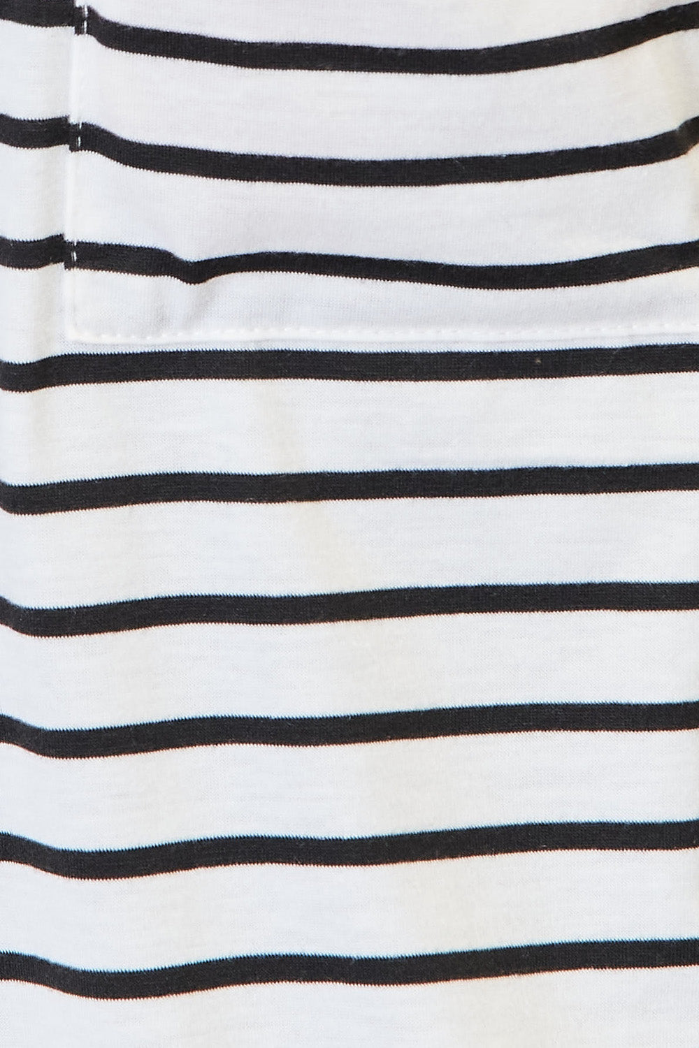 White striped open front longline cardigan from Trendsi, featuring a cozy, relaxed fit and stylish vertical stripe pattern.