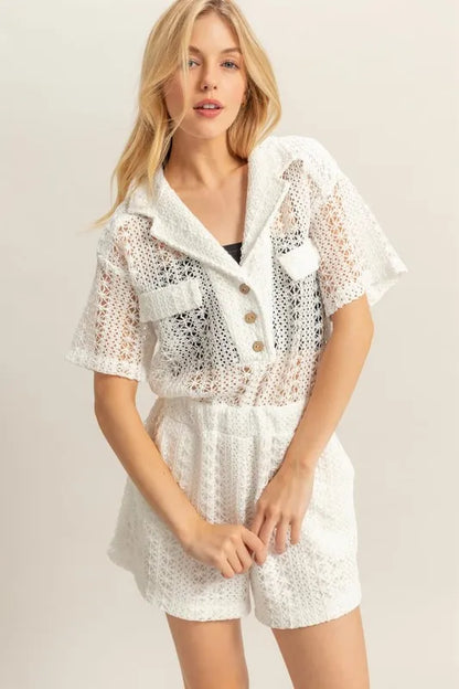 White crochet button-front short sleeve romper by HYFVE, featuring a relaxed fit and stylish design.