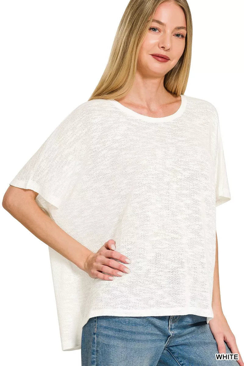 White Zenana oversized slub hacci top from Trendsi, featuring a relaxed fit and textured fabric, displayed on a mannequin.