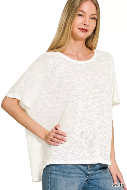 White Zenana oversized slub hacci top from Trendsi, featuring a relaxed fit and textured fabric, displayed on a mannequin.