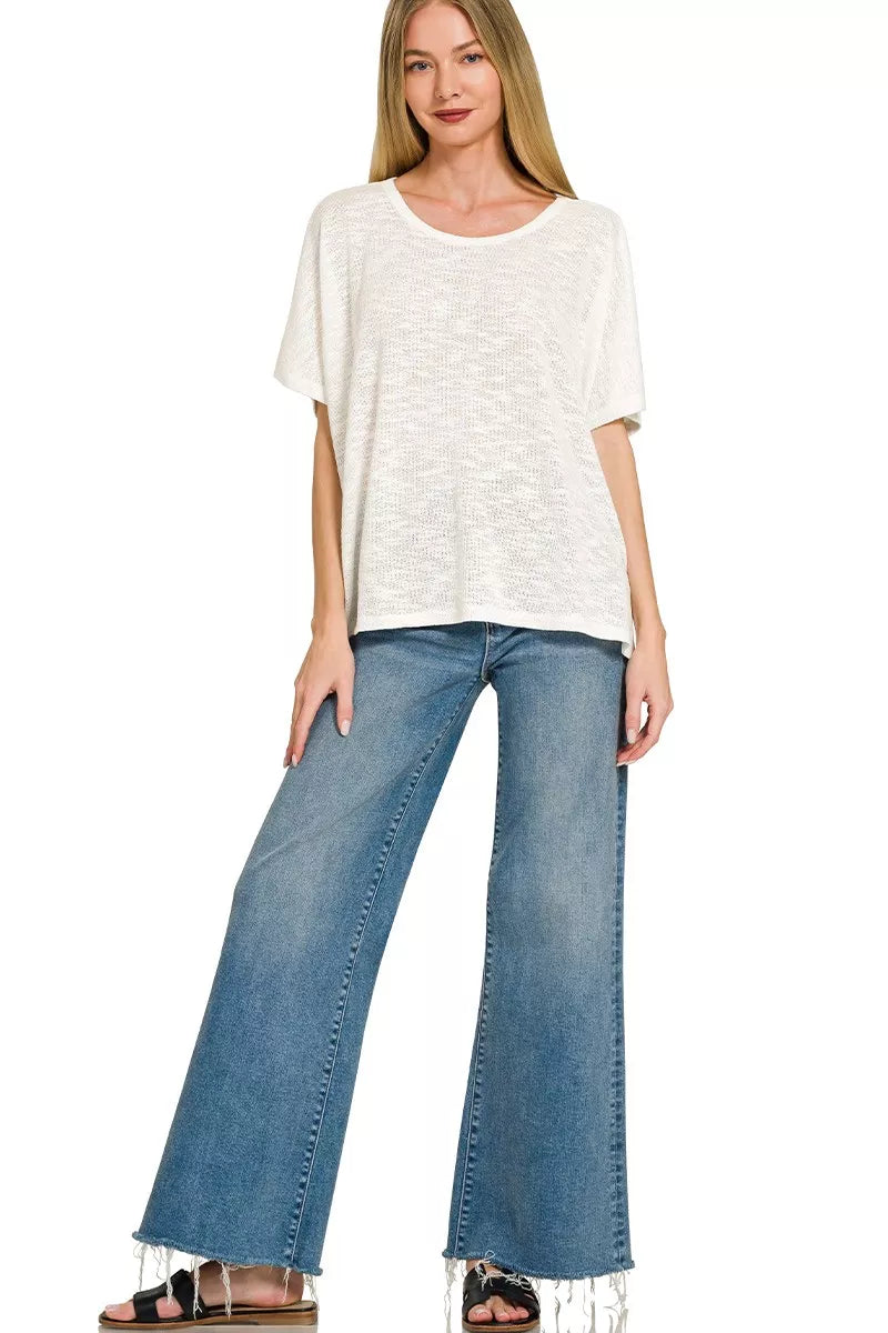 White Zenana oversized slub Hacci top with a relaxed fit, featuring textured fabric and short sleeves, perfect for casual wear.